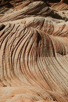 Waves of pattern on petrified red rock sand dunes in southern utah Stock Photos