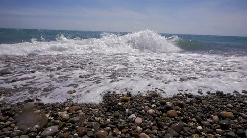Waves on a pebble beach Video stock 102506503