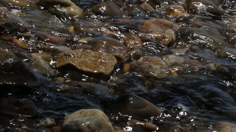 Waves on a pebble beach Stock Footage 132936286