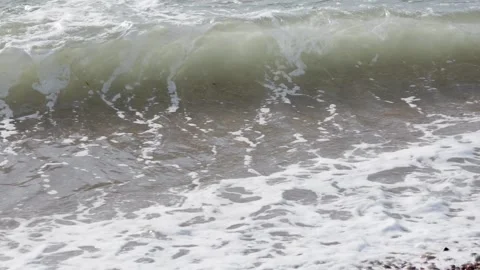 Waves on a pebble beach. Stock Footage 312698384