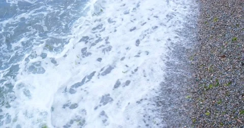 Waves on the pebble seashore. The concept of ecology, nature, water resource Stock Footage 220515379