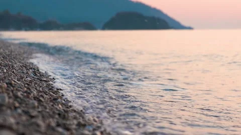 Waves on Pebbled Beach. Sunset or Sunrise Time. Stock Footage 145715830
