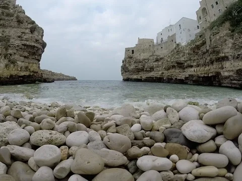 Waves on the pebbles, Polignano a Mare, Italy Stock Footage 86563120