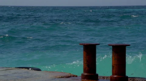 Waves at the pier Vídeos de archivo 64816715