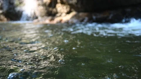 Waves from a pool from a mountain stream in front of waterfalls (slow motion) Stock-Footage 219418776