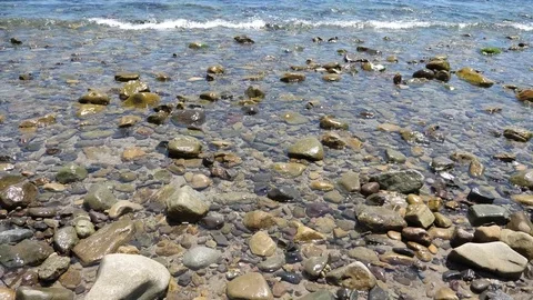 Waves Pouring Over Rocks Video stock 82311940