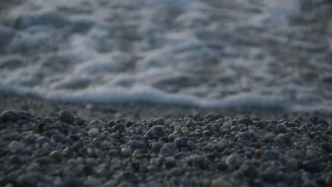 Waves on pubble beach - real time footage Stock Footage 83202018