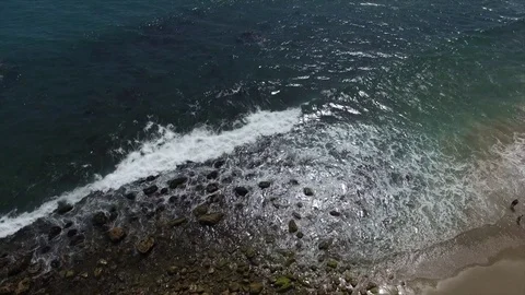Waves pushing onto a beach in Malibu Stock Footage 81721523