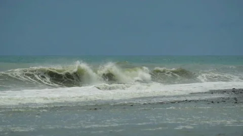 Waves in the raging sea in slow motion, in the background gloomy sky 動画素材 226896946
