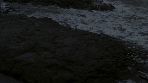 Waves reaching the coast during sunrise Stock Footage 81000428