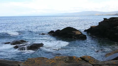 Waves reaching the rocks in the coast Stock Footage 217026718