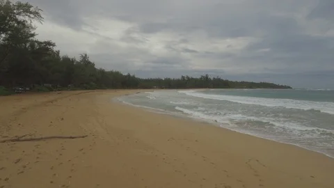 Waves reaching on sandy beach on a sunny day Stock Footage 104937021