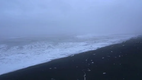 Waves reaching sea coast during foggy day Stock Footage 74908394