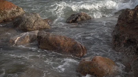 Waves reaching the shore of the beach in slow motion Stock Footage 129651133