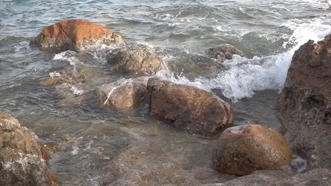 Waves reaching the shore of the beach in slow motion Stock Footage 129651185