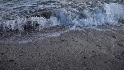 Waves reaching the shore of the beach in slow motion Stock Footage 129651370