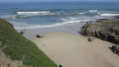 Waves reaching a tiny beach in the Cantabrian sea Stock Footage 234593675