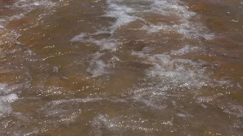 The waves of the Red Sea lap the sandy shore of an Egyptian beach, Egypt, Sharm Stock-Footage 333771875