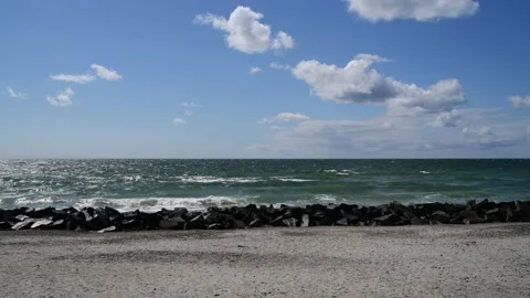Waves rinse to the beach of the german island HIDDENSEE in the baltic sea Video stock 142590859