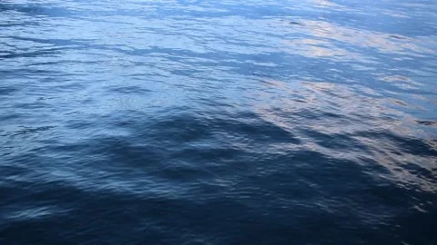 Waves on a river with reflections Stock Footage 130930703