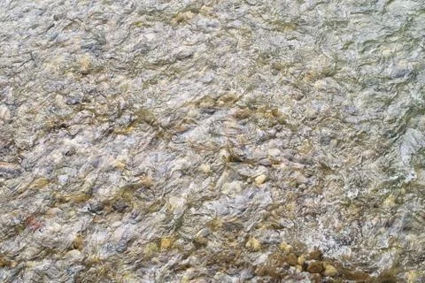 Waves on the river with rocks. Texture. Stock Photos