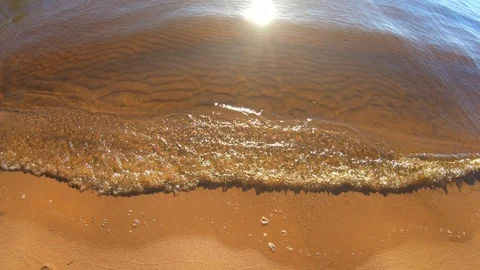 Waves of the river on a sandy beach Stock Footage 91740485