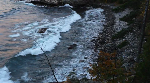 Waves on a rock beach from above Stock Footage 37216659