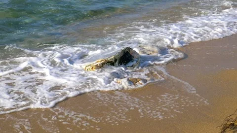 Waves on a rock Stock Footage 153247619