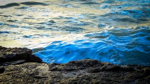 Waves on the rock Stock Photos