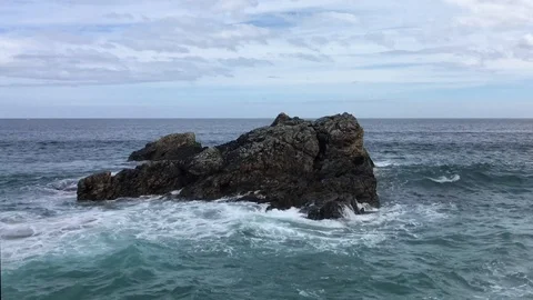 Waves on rock off Scottish coast Video stock 91373196