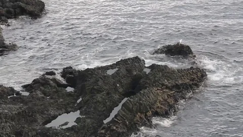 Waves on rocks in Acitrezza sicily Stock Footage 73302319
