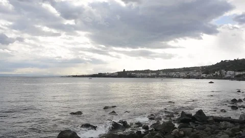 Waves on rocks in Acitrezza sicily Video stock 73302346