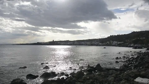 Waves on rocks in Acitrezza sicily Stock Footage 73302422
