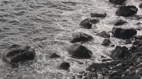 Waves on rocks in Acitrezza sicily Video stock 73302475