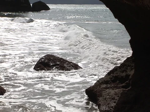 Waves with rocks on beach Stock Footage 93338722