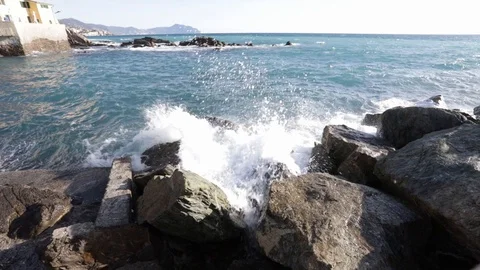 Waves on the rocks in Boccadasse Stock Footage 102291947