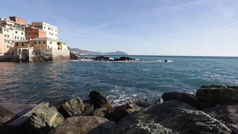 Waves on the rocks at Boccadasse Stock Footage 104333989