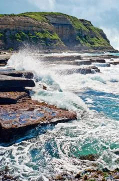 Waves on rocks at the coast Stock Photos