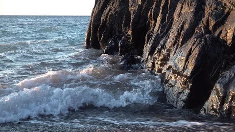 Waves on the rocks at dawn Stock Footage 104438465