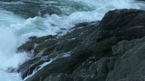 Waves on Rocks MS Slow Motion Stock Footage 83372181