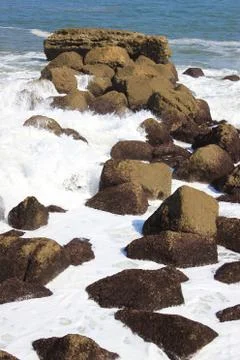 Waves on rocks Stock Photos