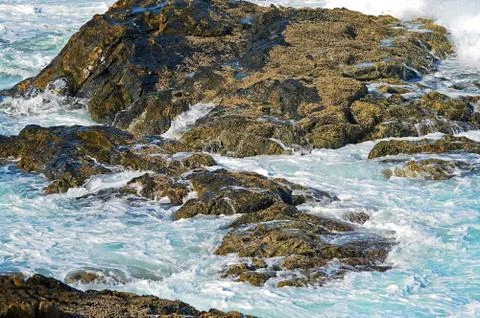 Waves on rocks Stock Photos