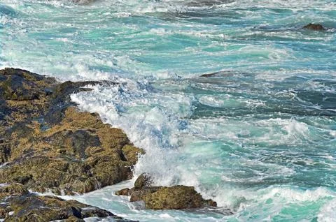 Waves on rocks Stock Photos