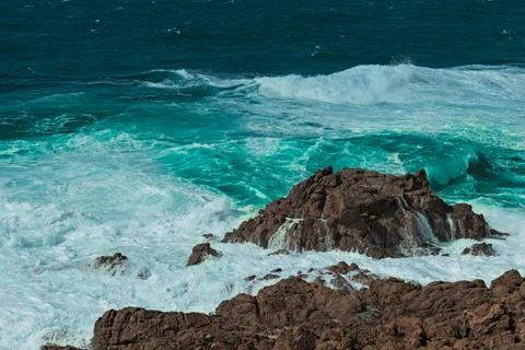 Waves on the rocks Stock Photos