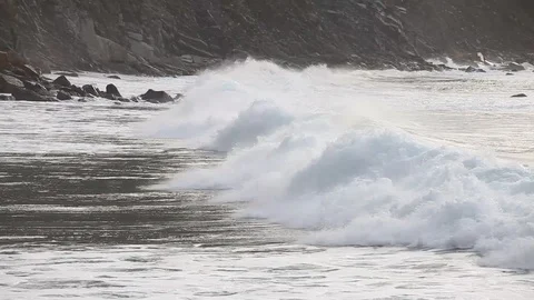The waves on the rocky beach close up view Video stock 87658008