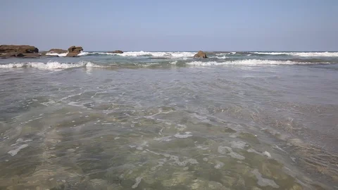 The waves on the rocky beach close up view Video stock 87658101