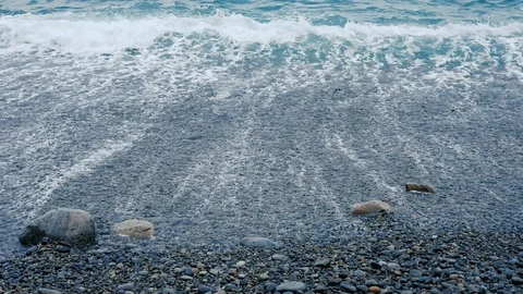 The waves on the rocky beach close up view Stock Footage 88100708