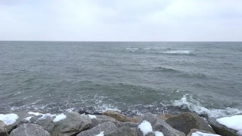 Waves on the rocky beach during winter in Gdynia, Poland. Stock Footage 258883232
