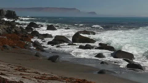 Waves on a rocky beach Stock Footage 10587069