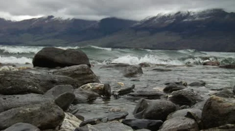 Waves on rocky beach Stock Footage 12760549